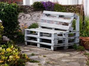 Wooden pallets can be cheaply upcycled to make garden furniture